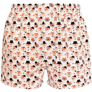 May include: White boxer shorts with a repeating pattern of orange foxes wearing glasses, hats, and moustaches.