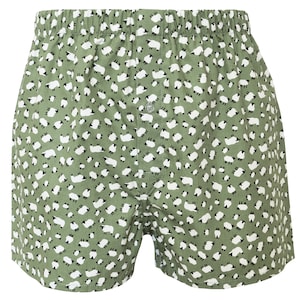 May include: Green boxer shorts with a white sheep pattern.