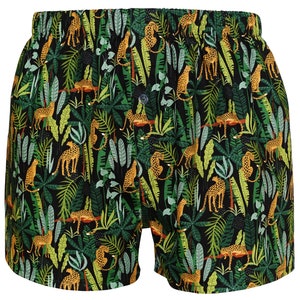 May include: Black boxer shorts with a jungle print featuring green leaves and orange leopards.