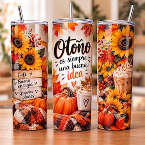 May include: Three tall cylindrical tumblers with metal straws featuring an autumn theme with sunflowers, orange pumpkins, plaid fabric, and coffee drinks. The center tumbler displays the text: Otoño es siempre una buena idea.