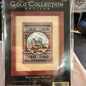 May include: A framed cross-stitch kit from The Gold Collection Petites, featuring a Southwest Blend design. The kit includes cotton embroidery thread, Aida fabric, a needle, and instructions. The frame size is 5" x 7" without a mat, or 8" x 10" with a mat.