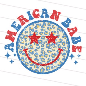 May include: A blue and yellow smiley face with red stars for eyes and the text "AMERICAN BABE" in red and blue letters around the face.