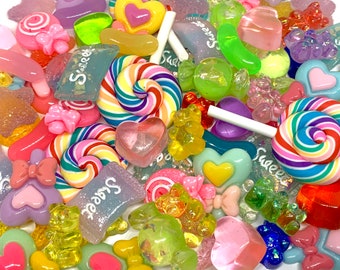 May include: Assortment of colorful candy charms, including lollipops, hearts, gummy bears, and candy canes. The charms are made of resin and have a glossy finish. The charms are perfect for adding a touch of sweetness to your crafts.