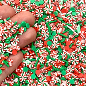 May include: A mix of red, white, and green candy cane and peppermint sprinkles. The sprinkles are perfect for decorating cakes, cupcakes, cookies, and other desserts.