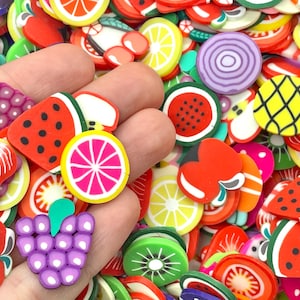 May include: A variety of colorful fruit-shaped polymer clay charms, including watermelon, grapes, strawberries, lemons, and pineapples. These charms are perfect for adding a touch of whimsy to jewelry, crafts, and other projects.