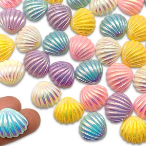 May include: Assortment of iridescent seashell-shaped buttons in various pastel colors, including pink, blue, yellow, and purple. The buttons are made of plastic and have a glossy finish.