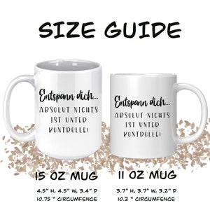 May include: Two white ceramic mugs with black text that reads "Entspann dich... ABSOLUT NICHTS IST UNTER KONTROLLE!" A size guide is included, with measurements in inches: 15 oz mug and 11 oz mug.