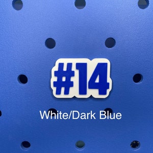 May include: White and dark blue number "#14" sticker on a blue background.