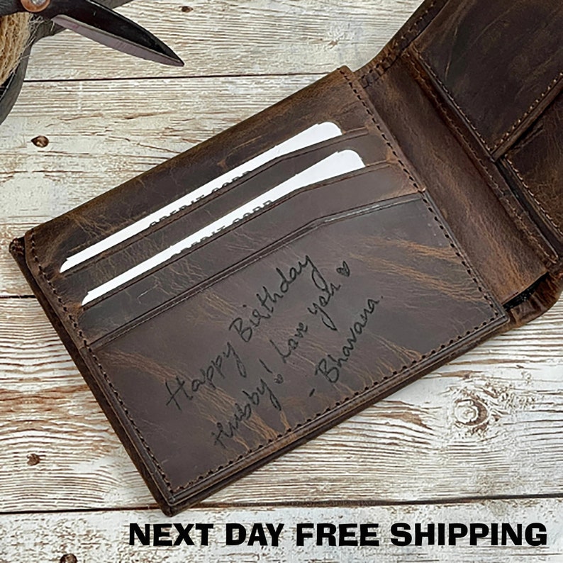 May include: A brown leather wallet with a personalized inscription that reads "Happy Birthday,  this by I love you" and is signed "Bhavana".