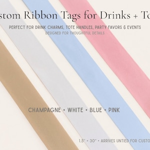 a variety of ribbons in different colors, including champagne, white, blue, and pink, arranged diagonally across the frame.