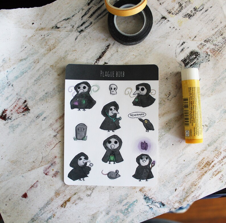May include: A sheet of stickers featuring a black and white illustration of a bird wearing a plague doctor mask. The stickers include various designs, such as the bird holding a vial, a skull, a tombstone, a mouse, and a raven. The text "Plague Birb" and "Nevermore" are included on the sheet.