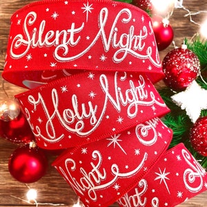 May include: Red ribbon with white glitter lettering that reads "Silent Night", "Holy Night", and "Night". The ribbon is decorated with small white stars.