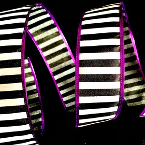 May include: Black and white striped ribbon with a purple edge. The ribbon is 2.5 inches wide and is perfect for crafting, decorating, and gift wrapping.