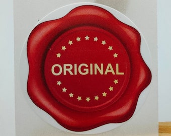 May include: A red wax seal sticker with a gold border and the word "ORIGINAL" in gold lettering. The sticker is on a white background.