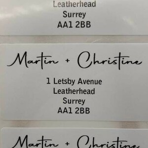 May include: Three white address labels with black text. The labels read "Martin + Christine", "1 Letsby Avenue", "Leatherhead", "Surrey", and "AA1 2BB".