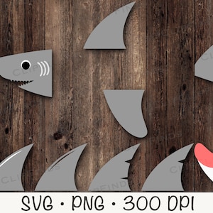 May include: A set of gray shark fin shapes on a wood background. The set includes a shark head, a large fin, and several smaller fins. The text "SVG. PNG. 300 DPI" is at the bottom of the image.