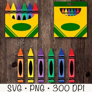 May include: A set of eight crayons in a yellow box with a green label. The crayons are red, orange, yellow, green, blue, purple, brown, and black. The crayons are arranged in a row in the box. The box is on a wooden background.
