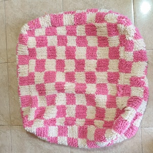 Pouf marocain en farine à carreaux roses berbère,