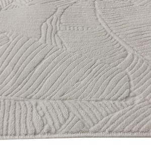 May include: White area rug with a textured, embossed pattern of leaves. The rug has a subtle sheen and a soft, plush feel.
