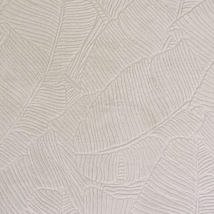 May include: White textured wallpaper with a repeating pattern of embossed banana leaves.
