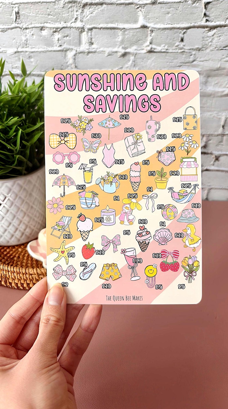 May include: A rectangular card with the text "SUNSHINE AND SAVINGS" and illustrations of summer-themed items like ice cream, sunglasses, and a swimsuit. The card is held by a hand.