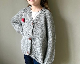 Oversized slouchy cardigan for kids. Strawberry cardigan. Chunky knit gender neutral sweater. Hand knit toddler cardigan with veggie brooch.