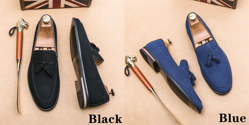 May include: Two pairs of suede tassel loafers. One pair is black and the other is blue.