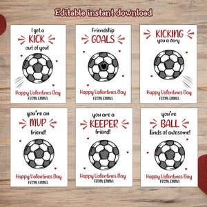 May include: Six Valentine's Day cards with soccer ball illustrations and phrases like "I get a kick out of you!" and "Friendship Goals." Each card has a soccer ball design and the text "Happy Valentines Day FROM EMMA."