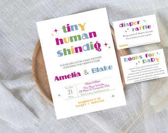 May include: A colorful baby shower invitation with the text "tiny human shindig" and the names Amelia and Blake. The invitation includes details for the event, including the date, time, location, and RSVP information. It also includes information about the couple's registry at Target and Amazon.