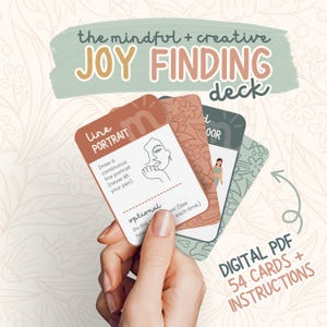 May include: A hand holding a deck of "JOY FINDING" cards. The cards are various colors and feature illustrations and text. The top card says "Line Portrait" and instructs the user to draw a continuous line portrait. The image also includes the text "DIGITAL PDF 54 CARDS + INSTRUCTIONS."