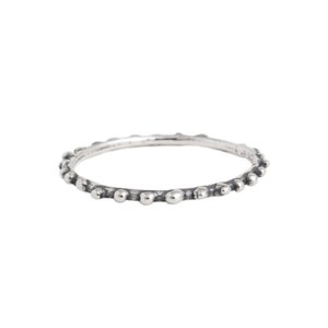 May include: A silver ring with a textured band of small, raised dots.