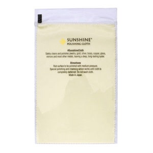 May include: A white plastic bag with a yellow label that reads "SUNSHINE" POLISHING CLOTH #Sunshine Cloth. The label also includes directions for using the cloth to polish jewelry, gold, silver, brass, copper, glass, mirrors, and other metals. The label states that the cloth is made in Japan.