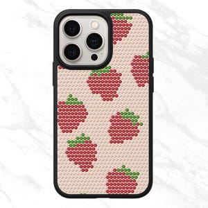 May include: A black iPhone case featuring a repeating pattern of red strawberries with green tops on a light beige background. The strawberries are made of small, round dots. The case has a black border and a camera cutout.