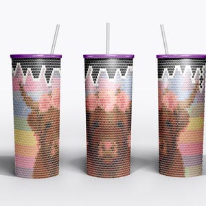 May include: Three insulated tumblers with a purple lid and a straw. The tumblers feature a colorful design with a brown, pink, and white image. The design is made up of small dots, giving it a pixelated look. The background is white.