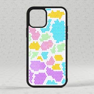 May include: A white phone case with a colourful geometric pattern. The pattern is made up of small hexagons in shades of pink, blue, yellow, and green.
