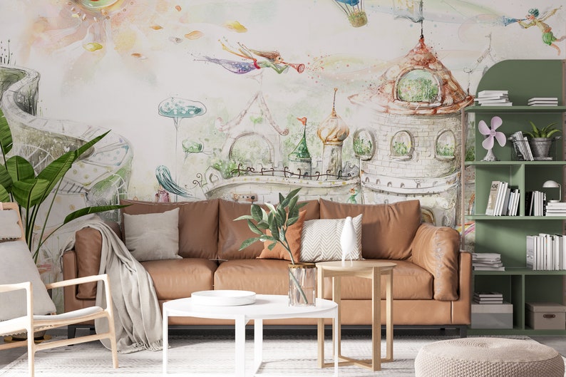 May include: A living room with a brown leather sofa, a white coffee table, a green bookshelf, and a whimsical watercolor mural depicting a fairytale castle with flying fairies.