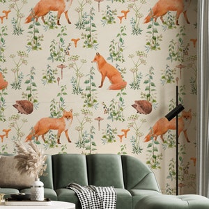 May include: Wallpaper featuring a repeating pattern of orange foxes, brown hedgehogs, and orange mushrooms amidst green foliage on a cream background. The scene evokes a woodland theme, suitable for interior design.