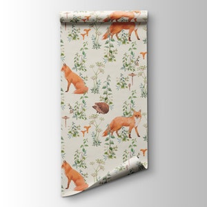 May include: A roll of wallpaper featuring a repeating pattern of foxes, mushrooms, and greenery. The foxes are a vibrant orange, and the mushrooms are tan. The background is a light beige color, creating a natural, woodland theme.