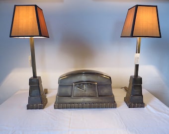 Brass mantel clock with two brass table lamps by Lumière