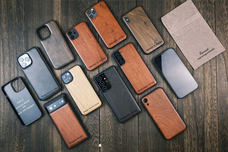 a group of cell phones sitting on top of a wooden table