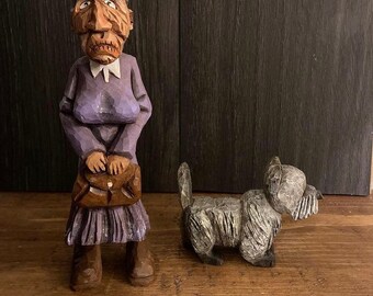 Old lady and her dog caricature carving