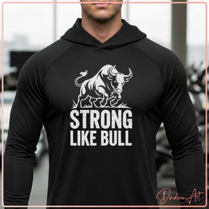 May include: Black hoodie with a white graphic of a bull and the text "STRONG LIKE BULL". The design features a charging bull with the text below it. The hoodie has a hood and long sleeves.