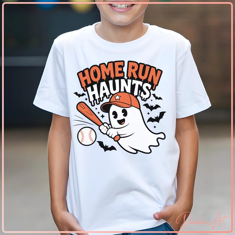 May include: White t-shirt with a cartoon ghost wearing a baseball cap and holding a bat, with a baseball. The shirt has the text "HOME RUN HAUNTS" in orange and black, with bats around the text and ghost.