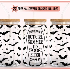 May include: Three glass tumblers with wooden lids and glass straws. The tumblers feature a black bat and star pattern, with one tumbler displaying the text "MOVE OVER HOT GIRL SUMMER IT'S SPOOKY BITCH SEASON". The image includes the text "22 FREE HALLOWEEN DESIGNS INCLUDED".