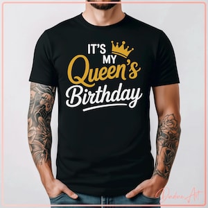 May include: Black t-shirt with the text "IT'S MY Queen's Birthday" in gold and white, topped with a gold crown graphic. The shirt is a crew neck style.