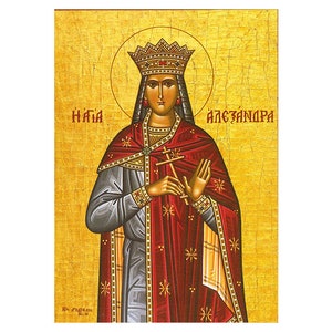 May include: A religious icon depicting Saint Alexandra, a woman wearing a crown and a red and gold robe, holding a cross in her hands. The icon has a gold background with a textured surface.