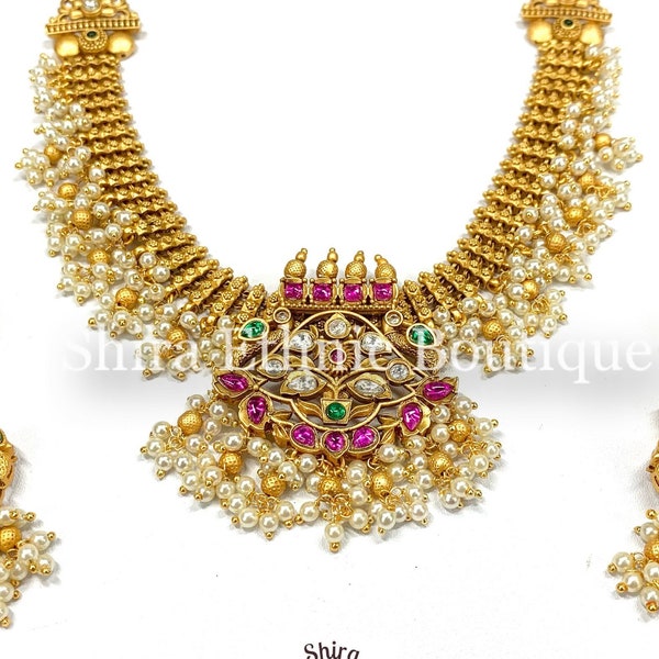 Statement guttapusalu necklace set in antique gold plating with semiprecious rubies, emeralds,kundans & pearls.Beautiful Bird earrings.