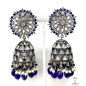 Statement jhumka in premium American diamonds and royal blue monalisa beads. Sparkling long earrings in royal blue hydro beads.