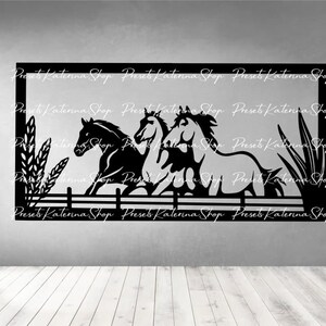 May include: Black silhouette of three horses running through a field with tall grass and a fence. The image is framed with a black border.