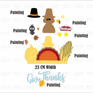 K&ouml;nnte beinhalten: Ein Thanksgiving-Bastelprojekt mit einem Truthahn, einem K&uuml;rbis, Mais und einer Torte. Das Bastelprojekt ist 23 cm breit und enth&auml;lt die Worte "Give Thanks".